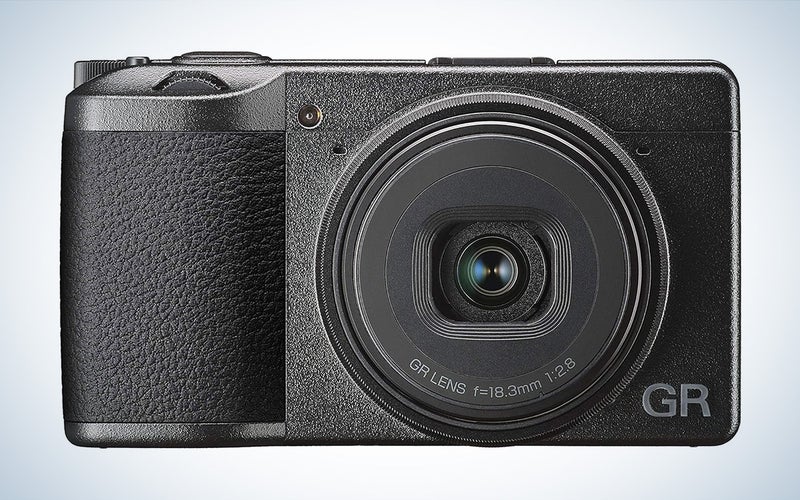 The Ricoh GR III compact digital camera is in front of a white background with a gray gradient.