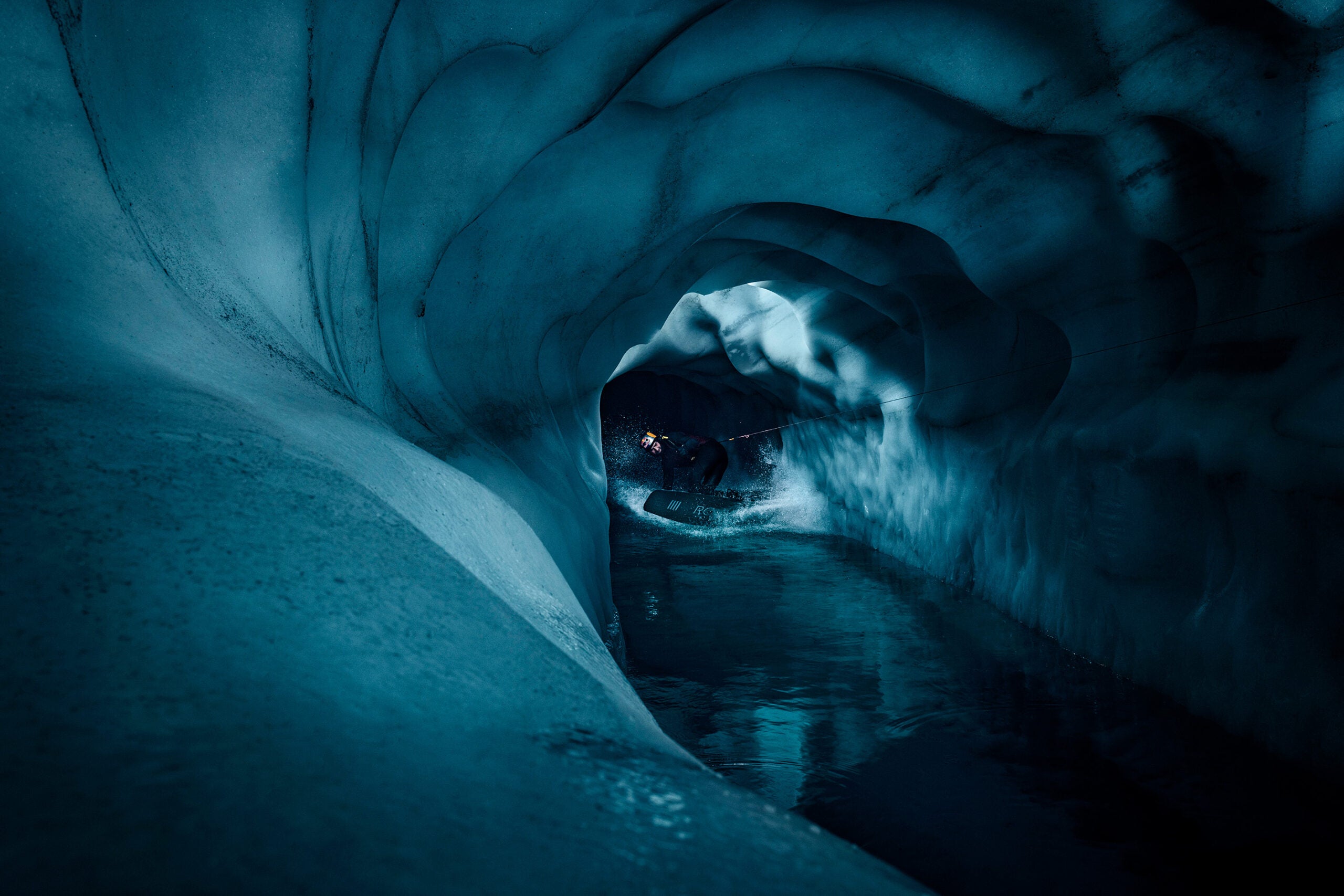 Markus Berger (Austria) won the Playground by WhiteWall category for his photograph, titled, âWake the Glacierâ of a wakeboarder waterskiing inside a glacier.