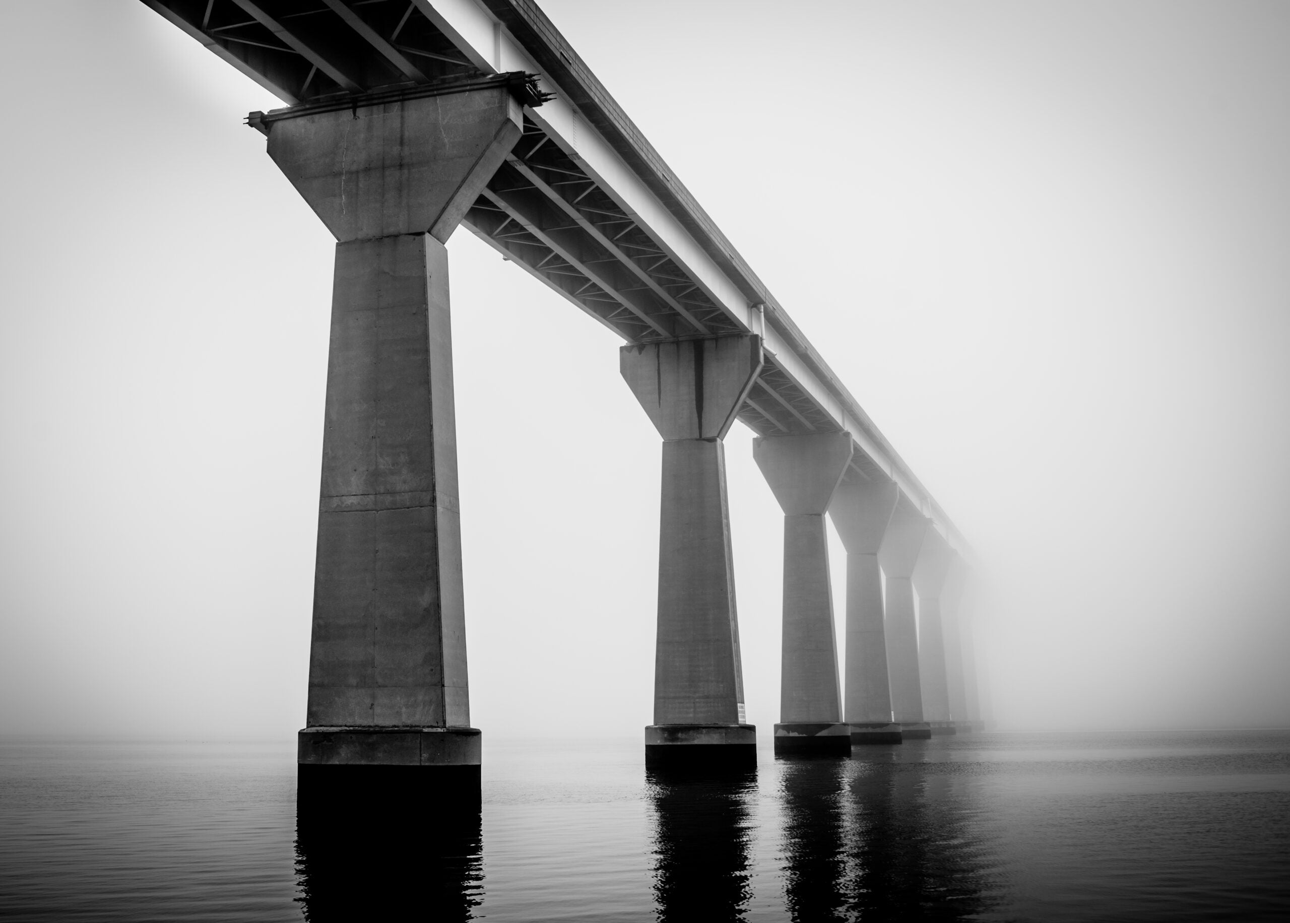 A misty bridge in monochrome. 