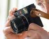 Leica M11 rangefinder camera held up to an eye