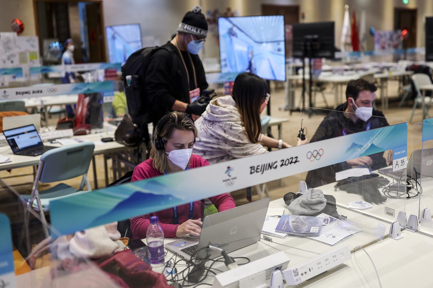 Journalists working in the press room at the 2022 Olympic Games.