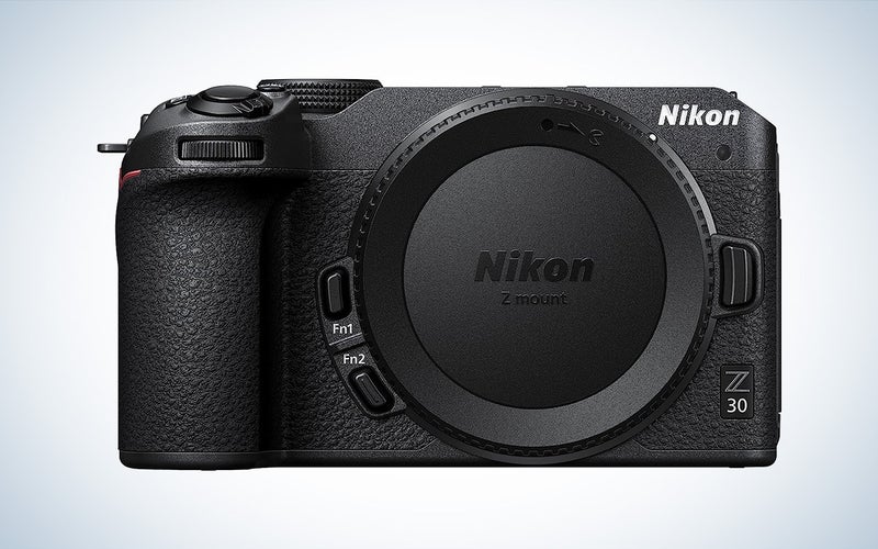 The black Nikon Z30 mirrorless vlogging camera against a white background
