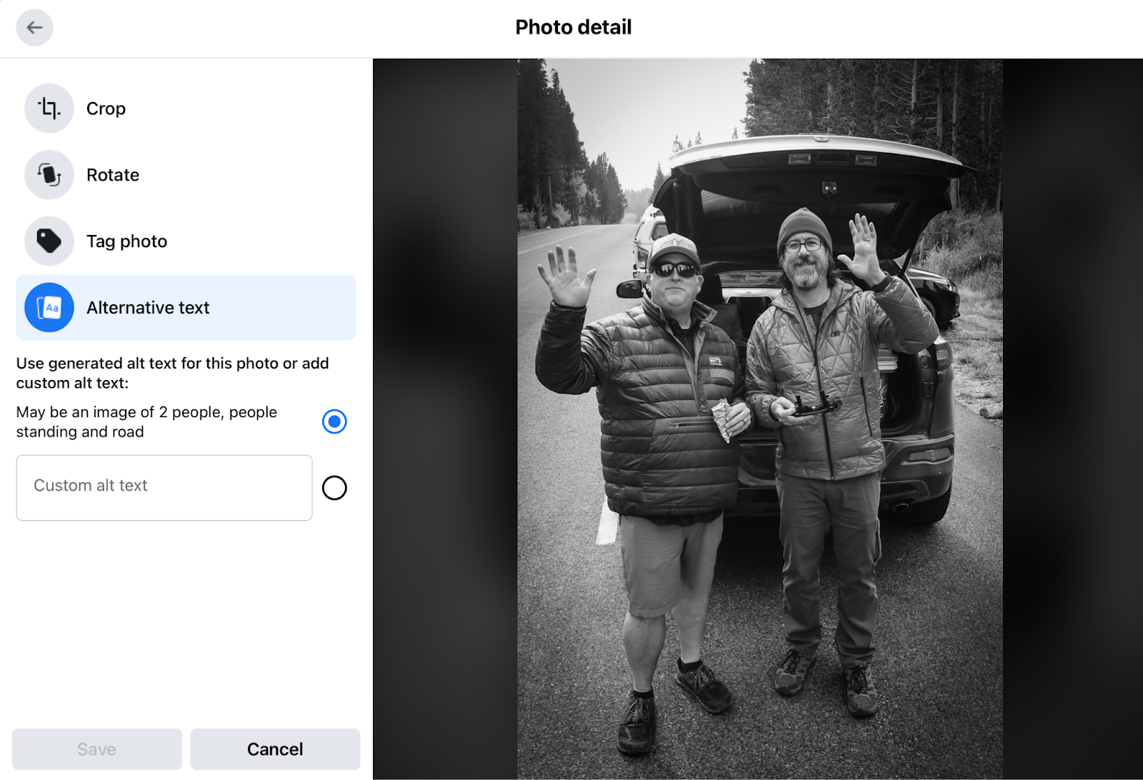 A B&W photo of two men holding an umbrella in an image editing window.