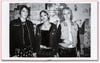 A B&W photo of three young women dressed in "punk" gear.