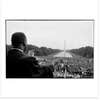 A photo of Dr. Martin Luther King speaking on the steps of the Lincoln Memorial.
