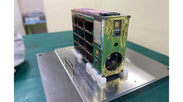 A modified Pentax 300mm f/4 heads into space aboard a nanosatellite