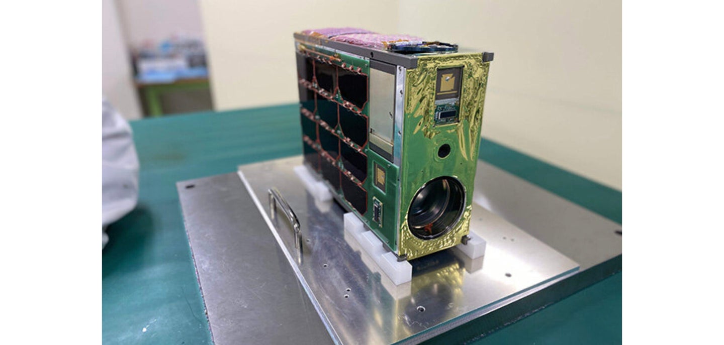 The completed satellite with lens aboard.