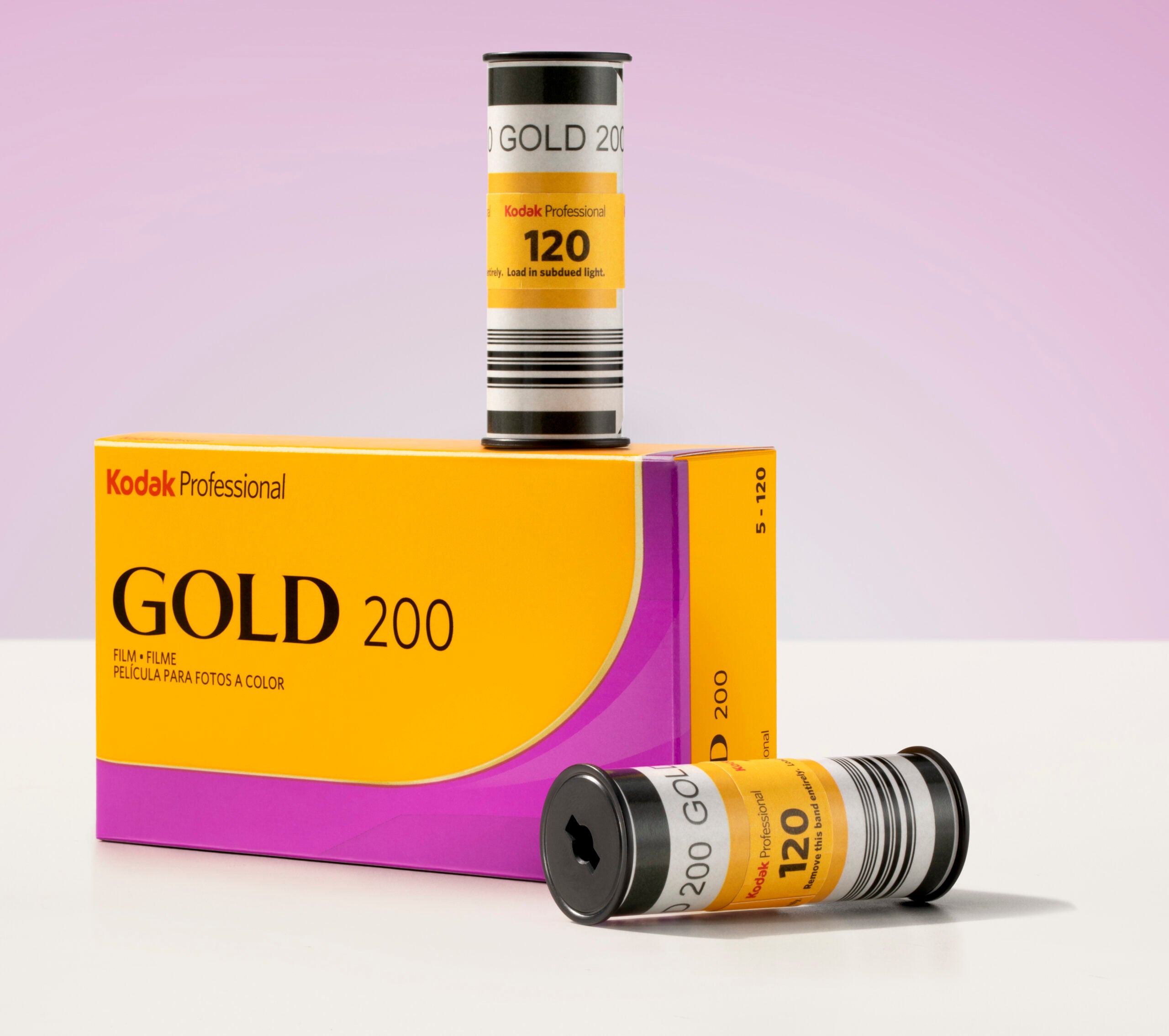 Kodak Gold 200 film rolls sitting on a box