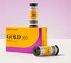 Kodak Gold 200 film rolls sitting on a box