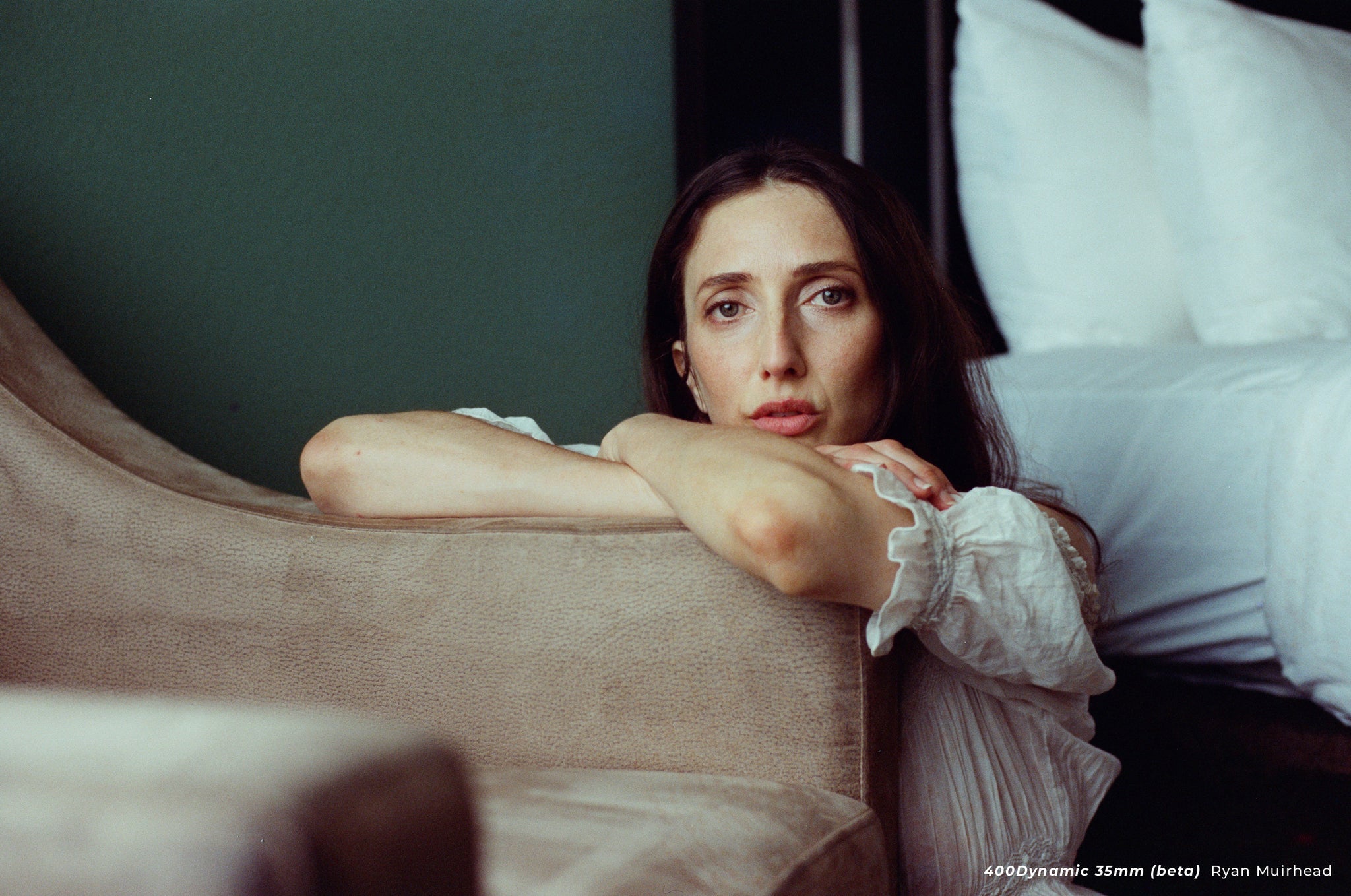 Portrait of a woman by window light shot with CineStill 400D. 