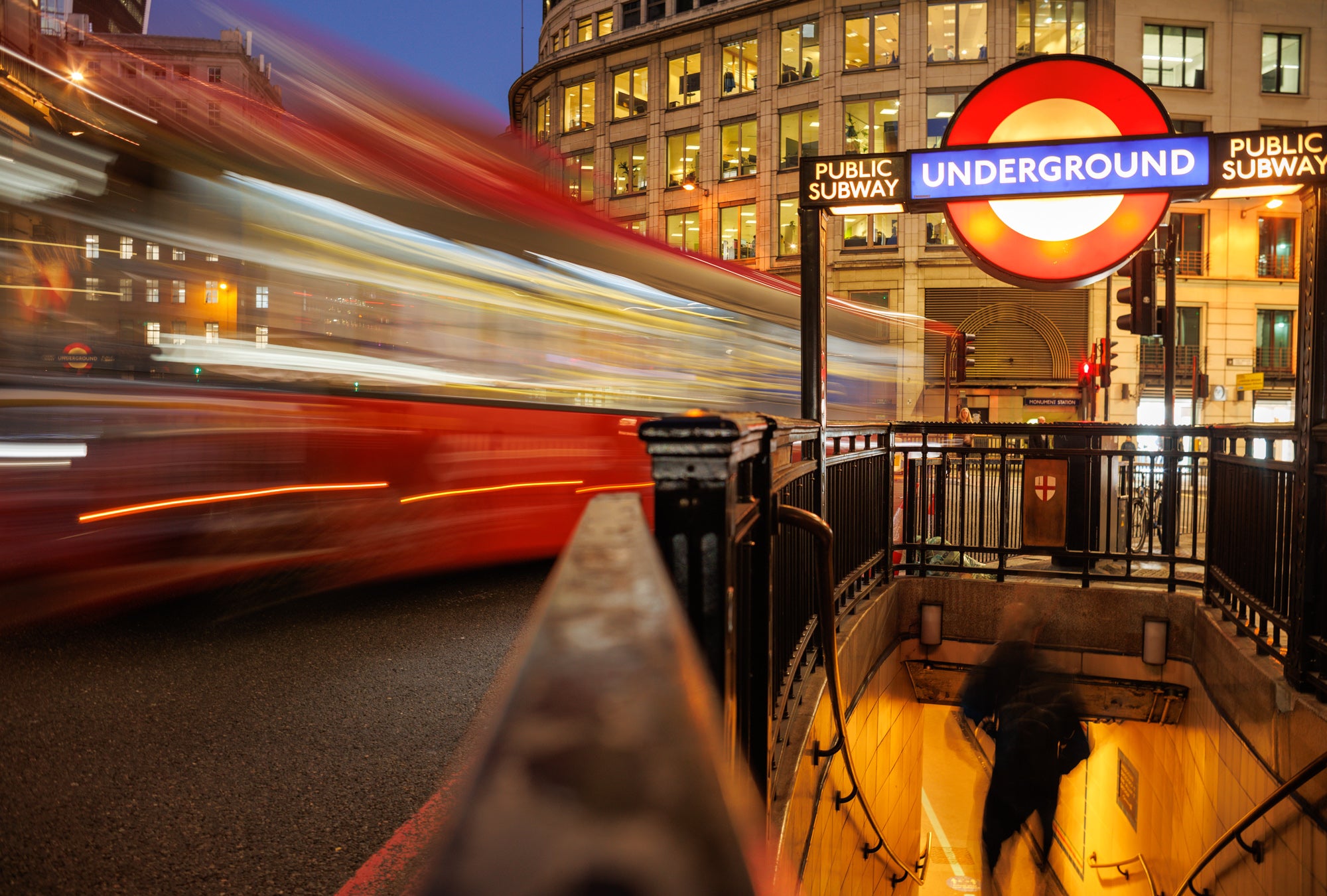 A long exposure taken outside a London tube station at dusk.