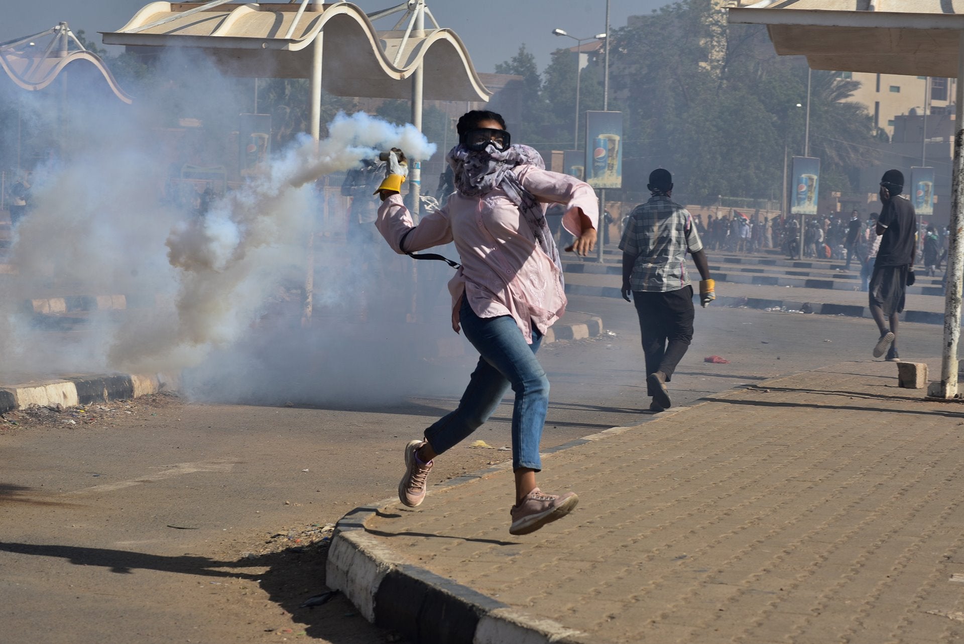 Sudanese photographer Faiz Abubakr Mohamed won the Singles category for this photo from a march demanding the end of military rule in the Sudanese capital Khartoum.