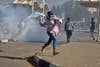 Sudanese photographer Faiz Abubakr Mohamed won the Singles category for this photo from a march demanding the end of military rule in the Sudanese capital Khartoum.