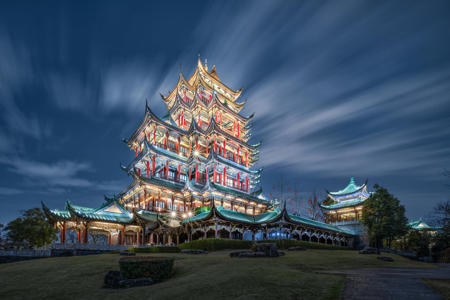 A sample long exposure photo of a temple on a hill lit up with lights.