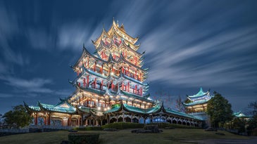 A sample long exposure photo of a temple on a hill lit up with lights.