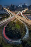 A long exposure sample of a city and highway with car light trails.