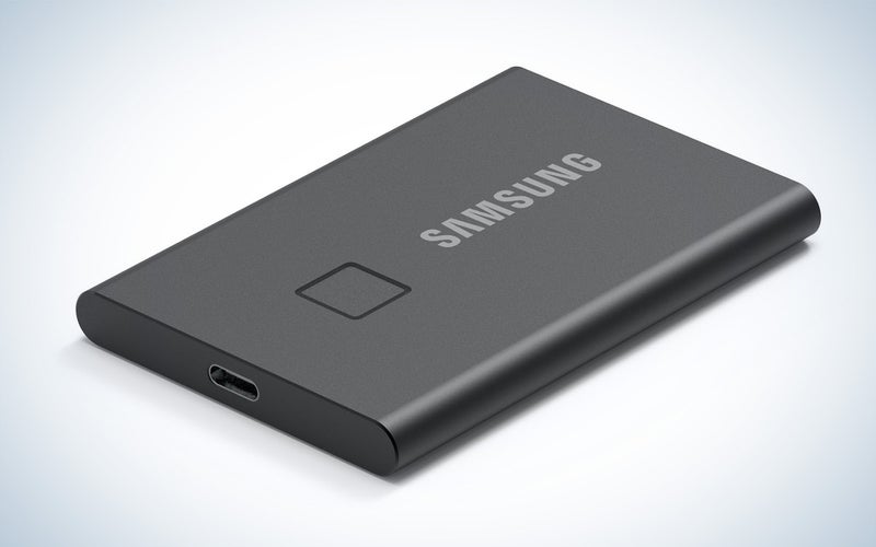 Samsung T7 Touch SSD drive on a plain background