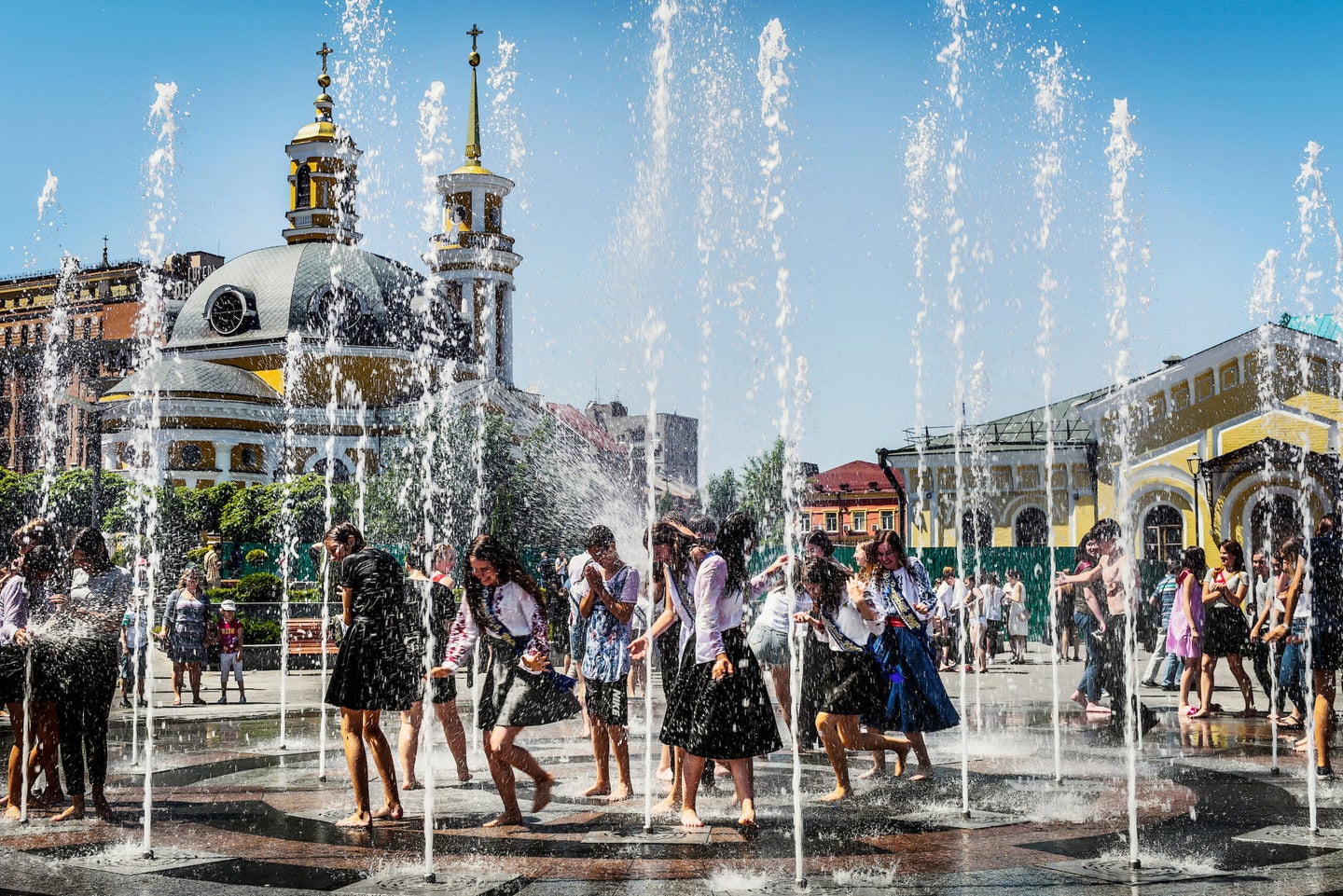 This was taken on May 30, 2018 in Kiev, Ukraine. After the Last Bell ceremony in schools, students from around the city come to Podil area of Kiev by the Dnepr river to bathe in a fountain. This is the most popular area for the students to hang out in.