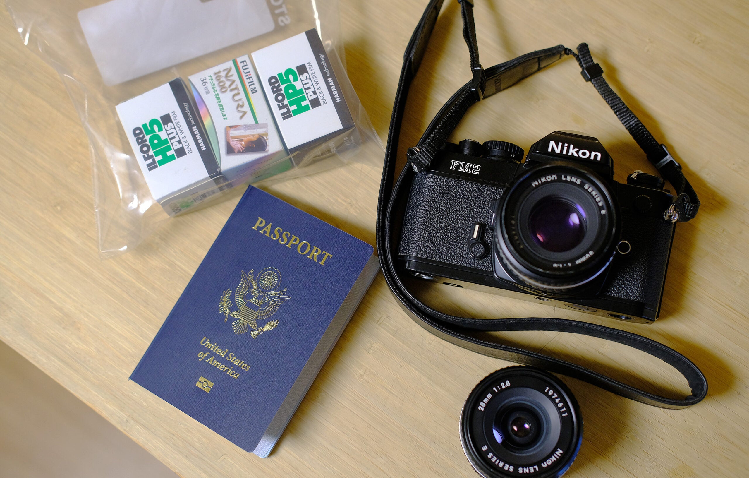 A camera, passport and film.