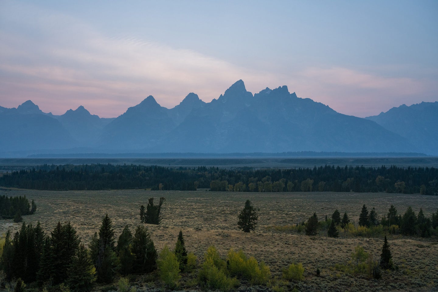 A pastel sunset over the Teton Mountain Range. Grand Teton National Park, Wyoming.