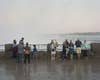 A crowd at Niagara Falls looking out at the water.