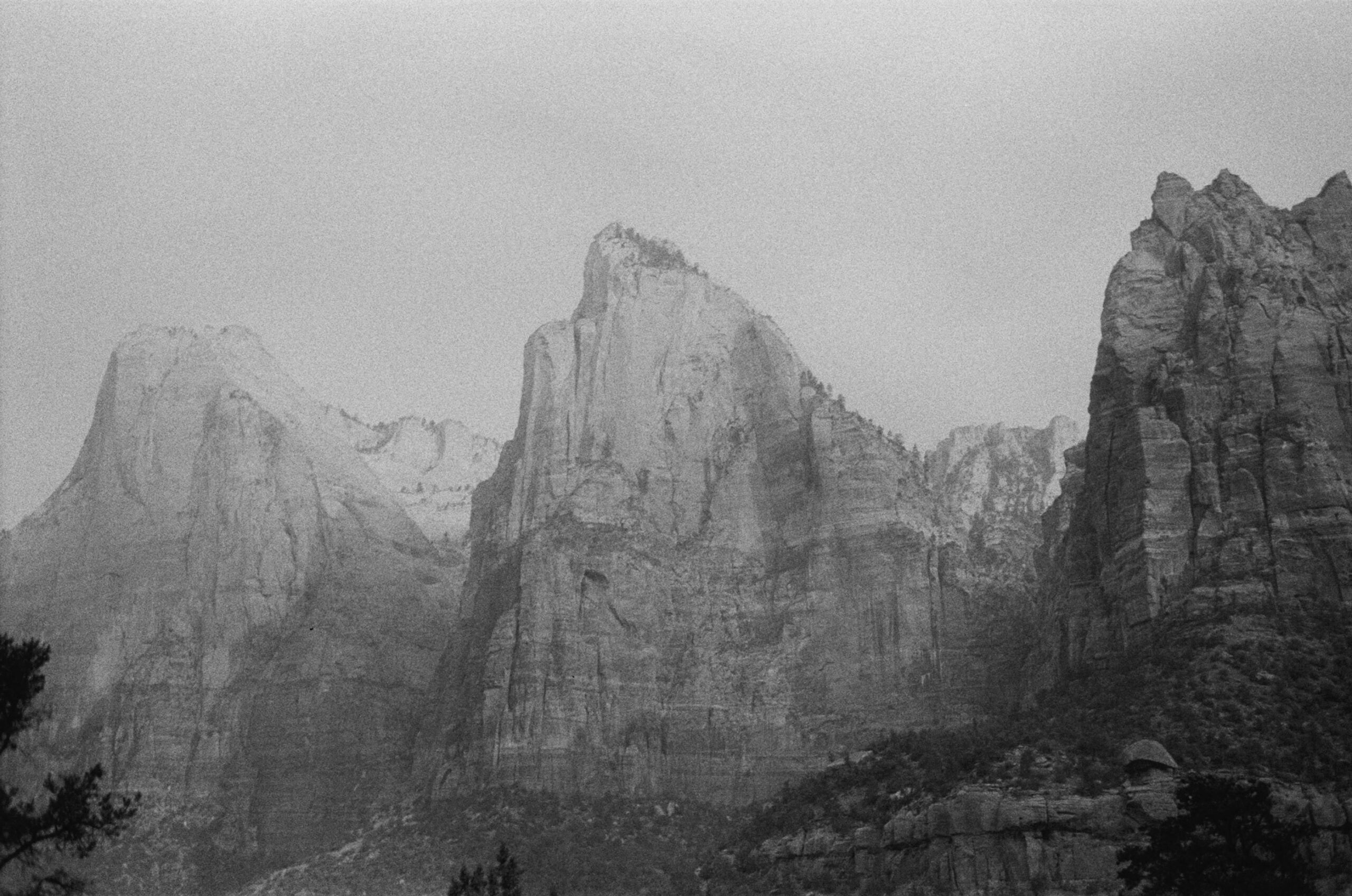 black and white photograph of the court of the patriarchs, a three-mountain rock formation in zion national park