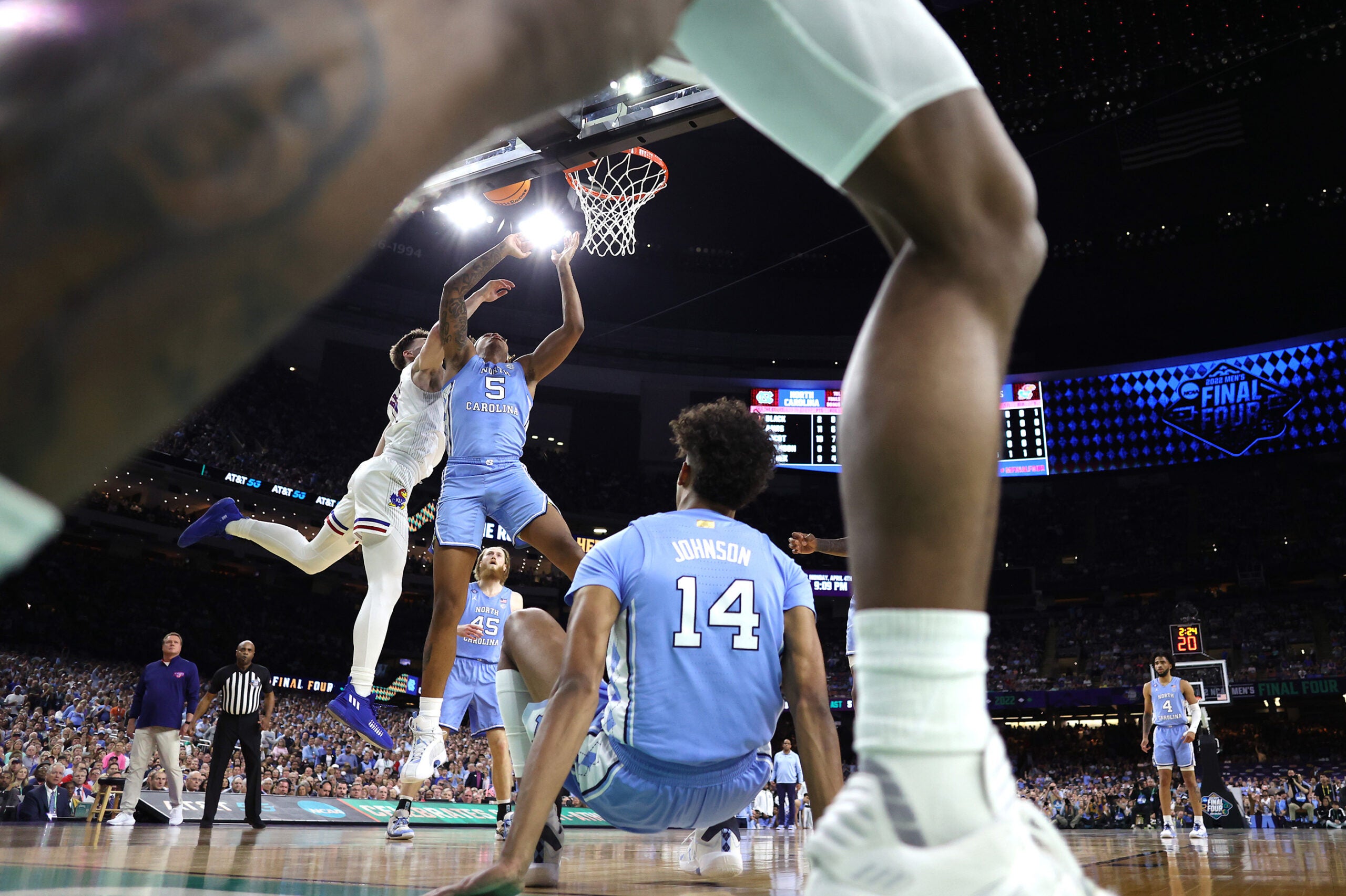 Armando Bacot #5 of the North Carolina Tar Heels shoots the ball as Christian Braun #2 of the Kansas Jayhawks defends in the first half of the game during the 2022 NCAA Men's Basketball Tournament National Championship. 