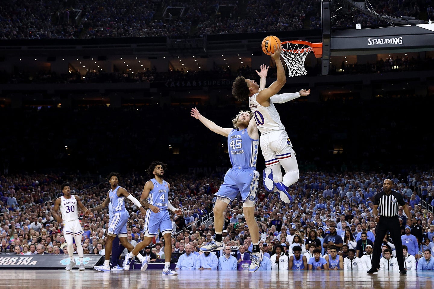 Jalen Wilson #10 of the Kansas Jayhawks shoots the ball as Brady Manek #45 of the North Carolina Tar Heels defends in the first half of the game during the 2022 NCAA Men's Basketball Tournament National Championship.