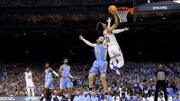 Jalen Wilson #10 of the Kansas Jayhawks shoots the ball as Brady Manek #45 of the North Carolina Tar Heels defends in the first half of the game during the 2022 NCAA Men's Basketball Tournament National Championship.