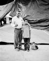 A black and white portrait of a migrant girl on the US Mexico border