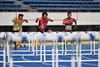 A photo of athletes running on a track.