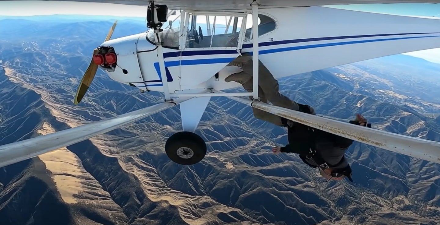 Trevor Jacob jumps from a small propeller plane.