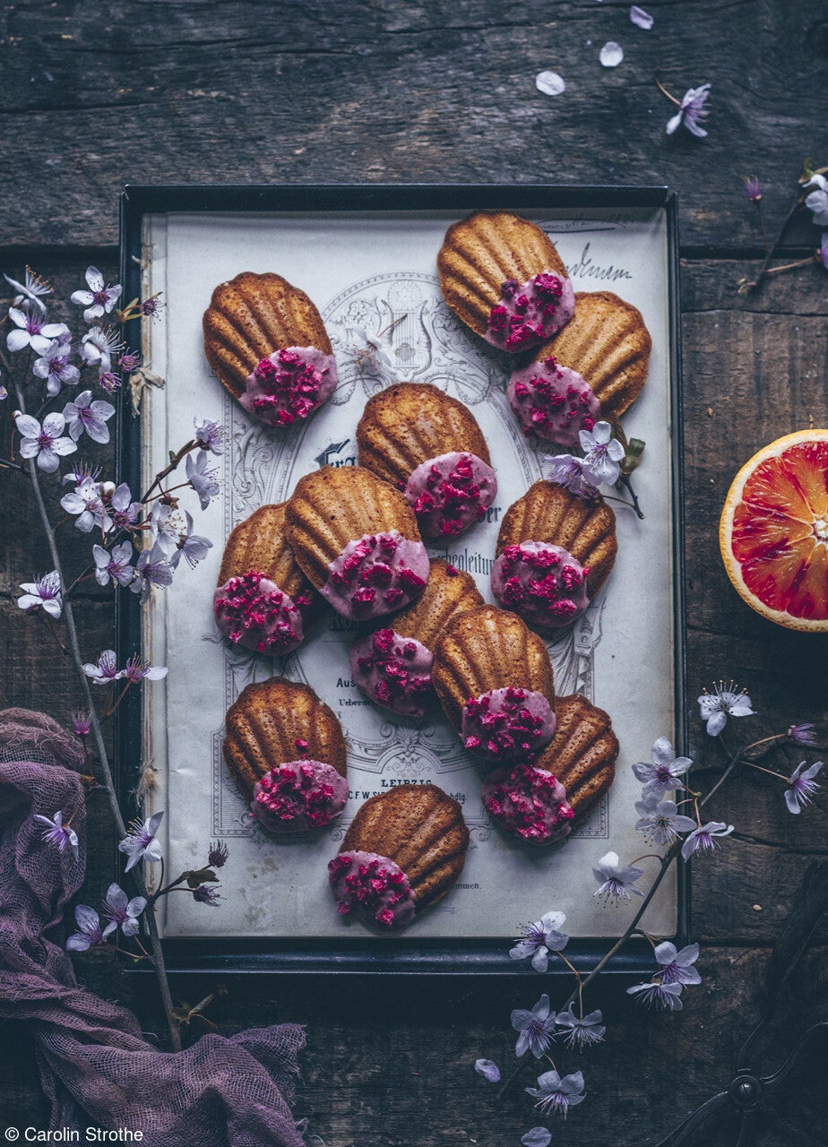 blood orange madeleines decorated with orange glaze