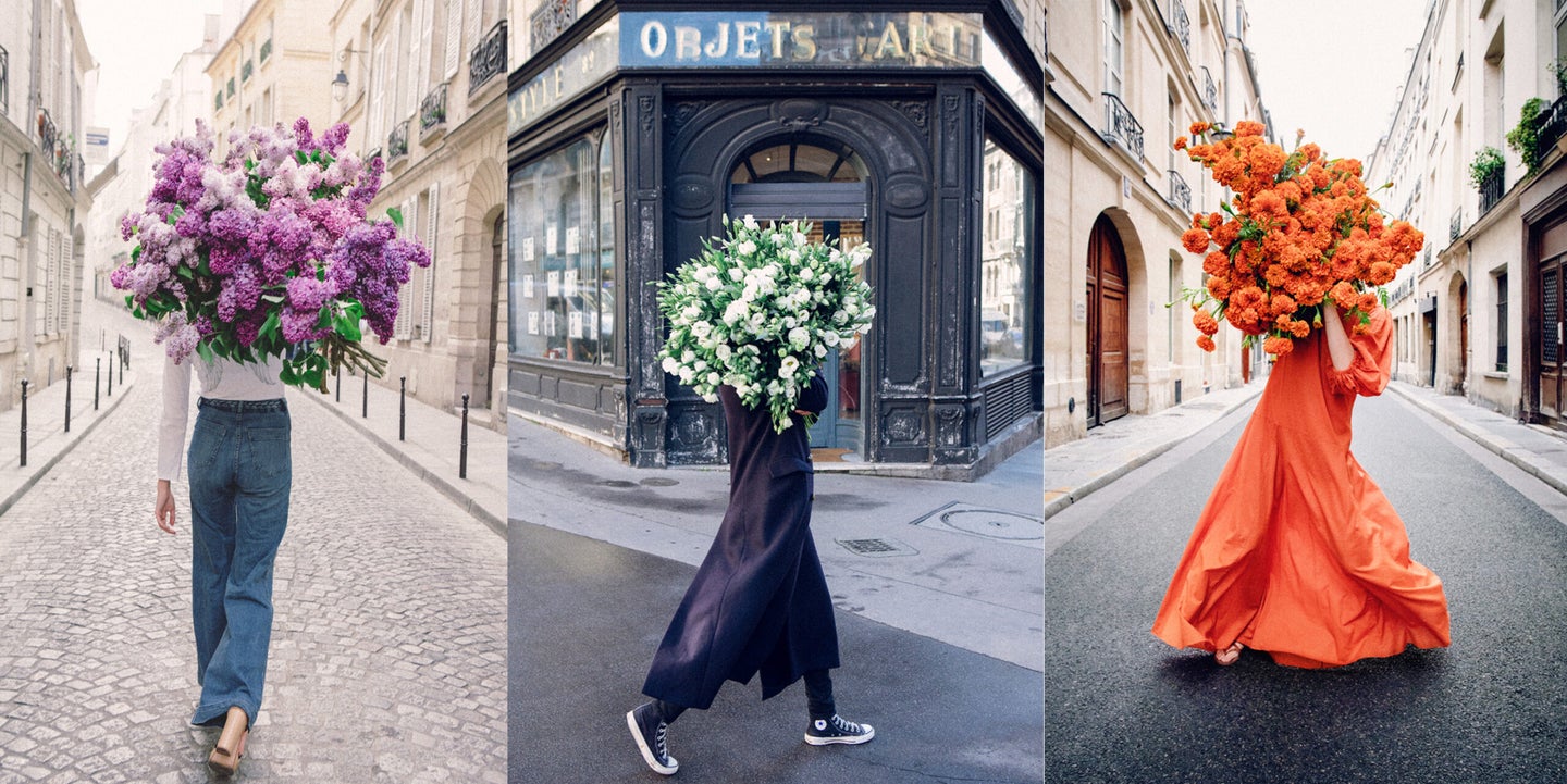 three girls holding large bouquets of flowers in paris