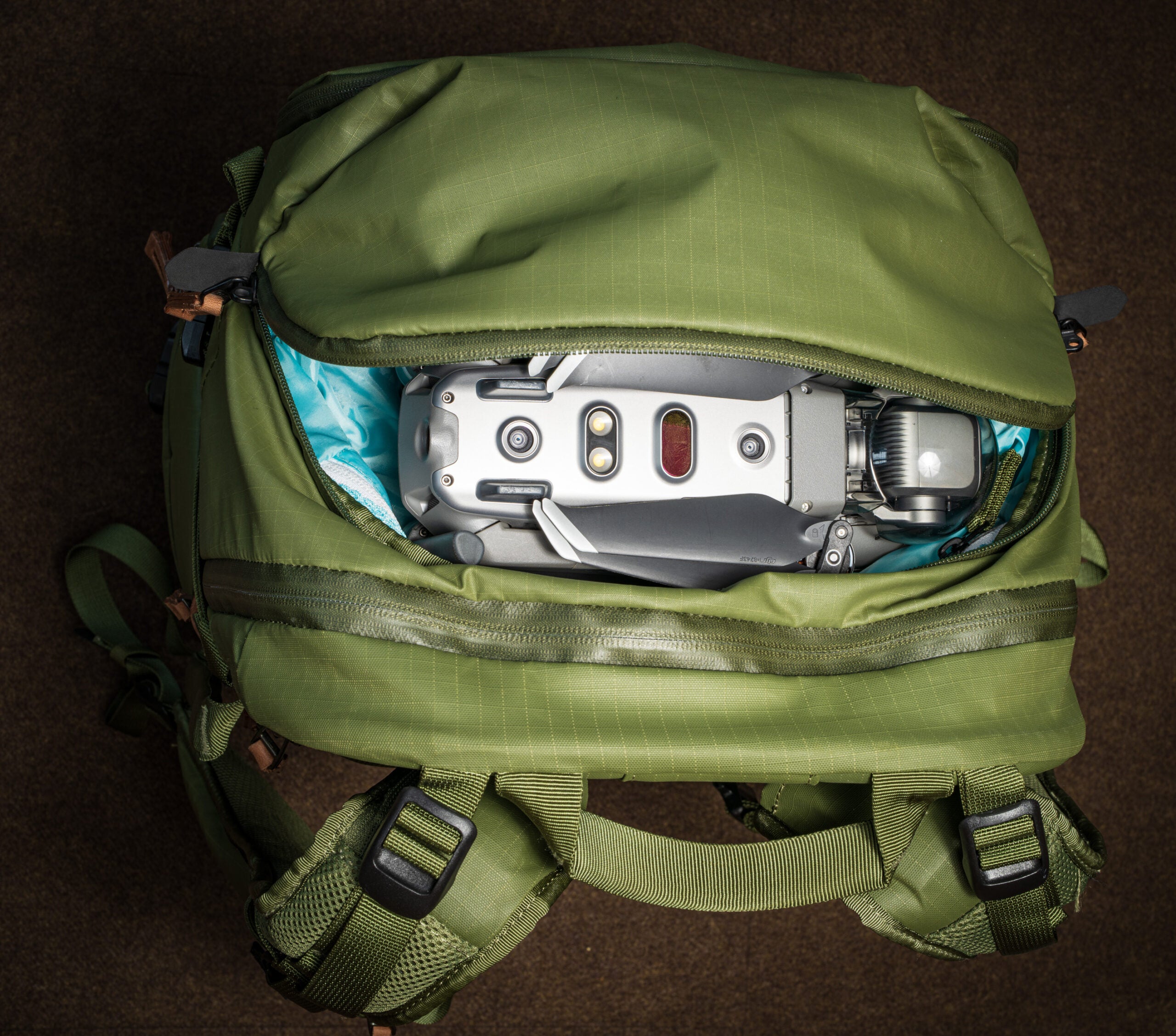 The top pocket of the new Shimoda Design Explore V2 backpacks with a drone inside.