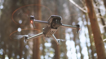 drone flying through the forest