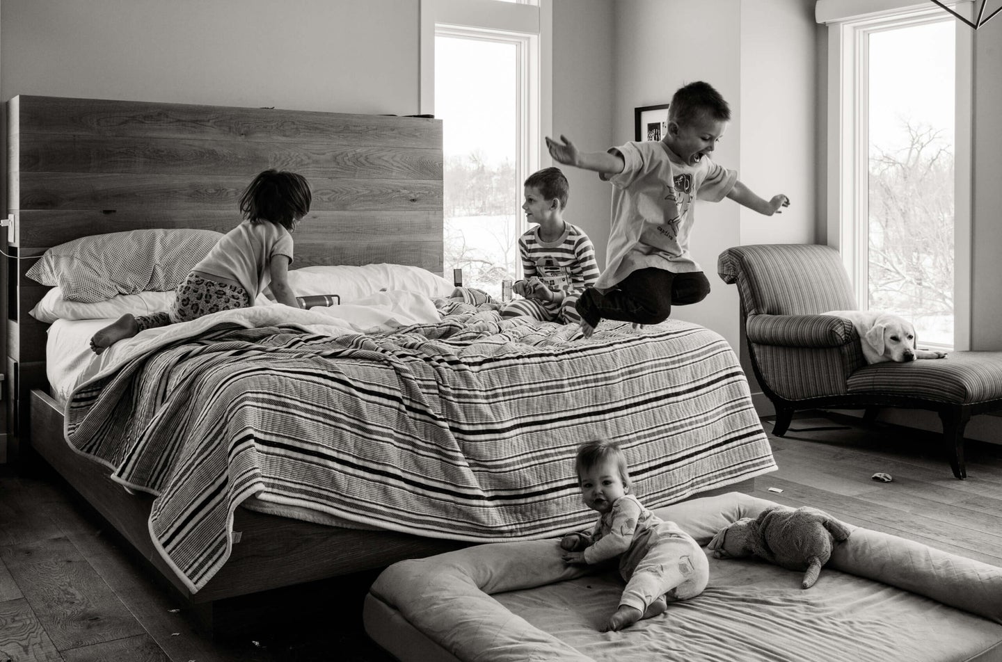 boy jumps off bed. how to photograph kids