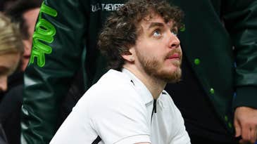 Rapper Jack Harlow messes with an NBA videographer’s gear during a live broadcast