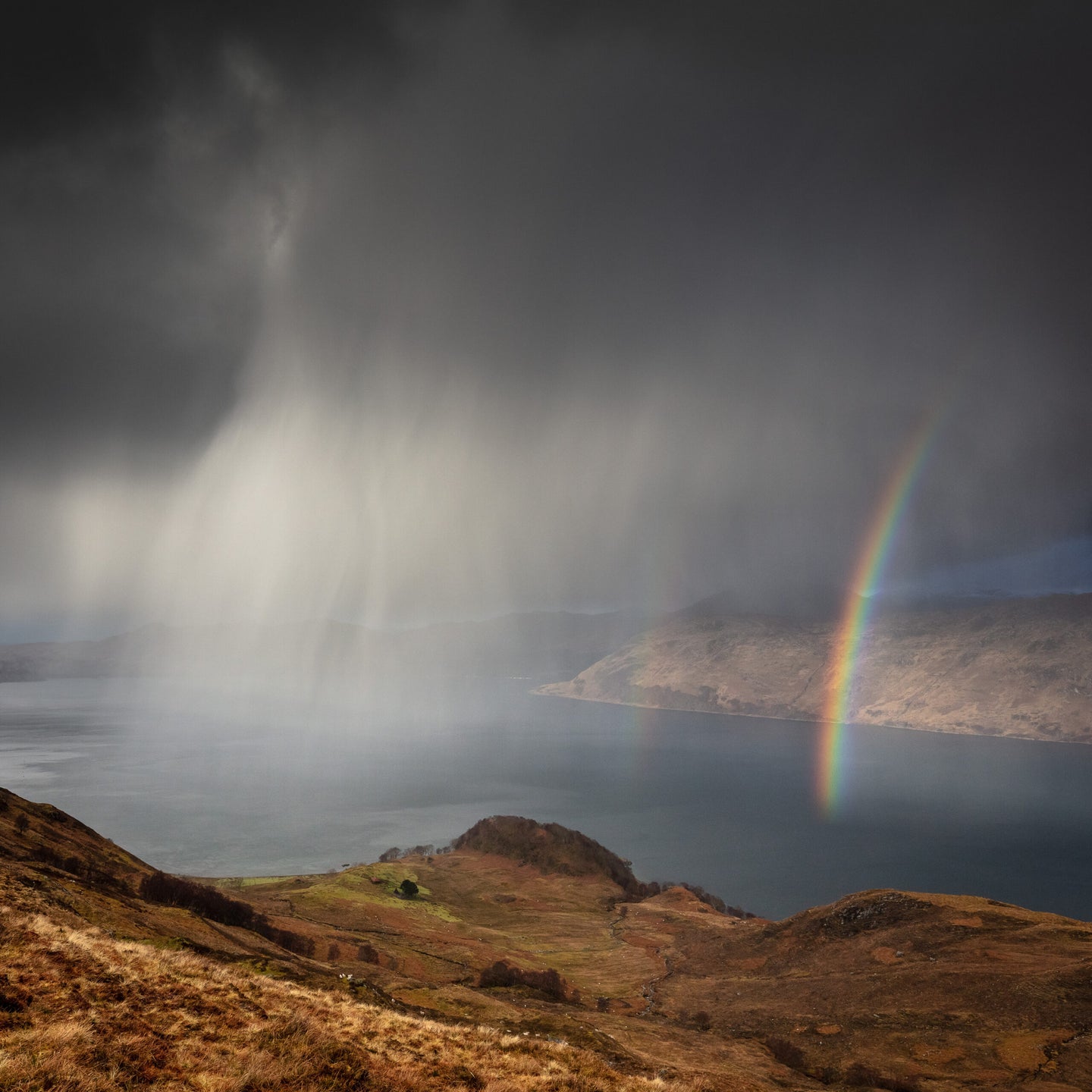 Scottish sublime. North Morar in the foreground with Knoydart behind the rainbow over Loch Nevis.