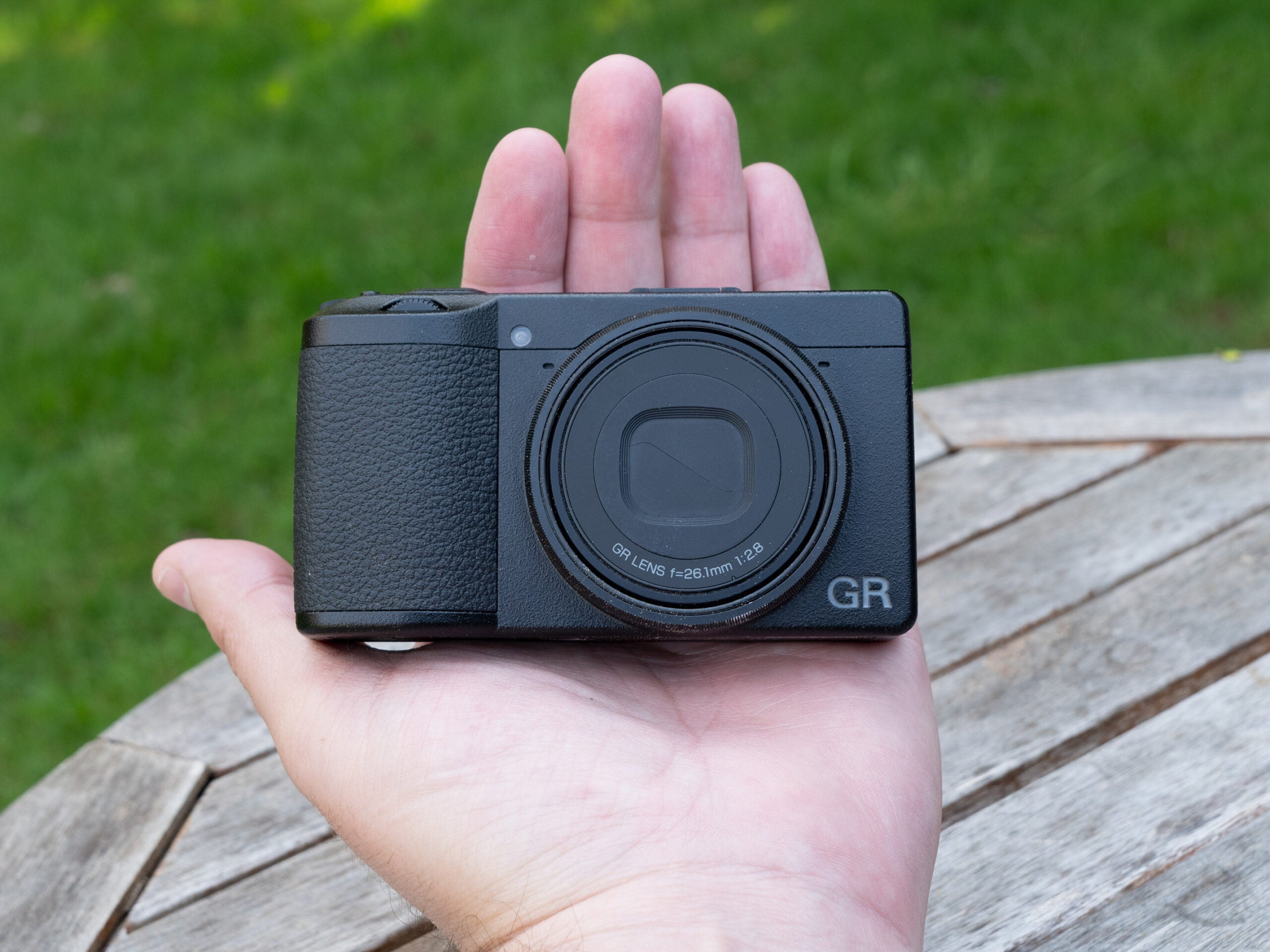 Ricoh GR IIIx in hand.