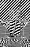 black and white stripes shown through water and glass