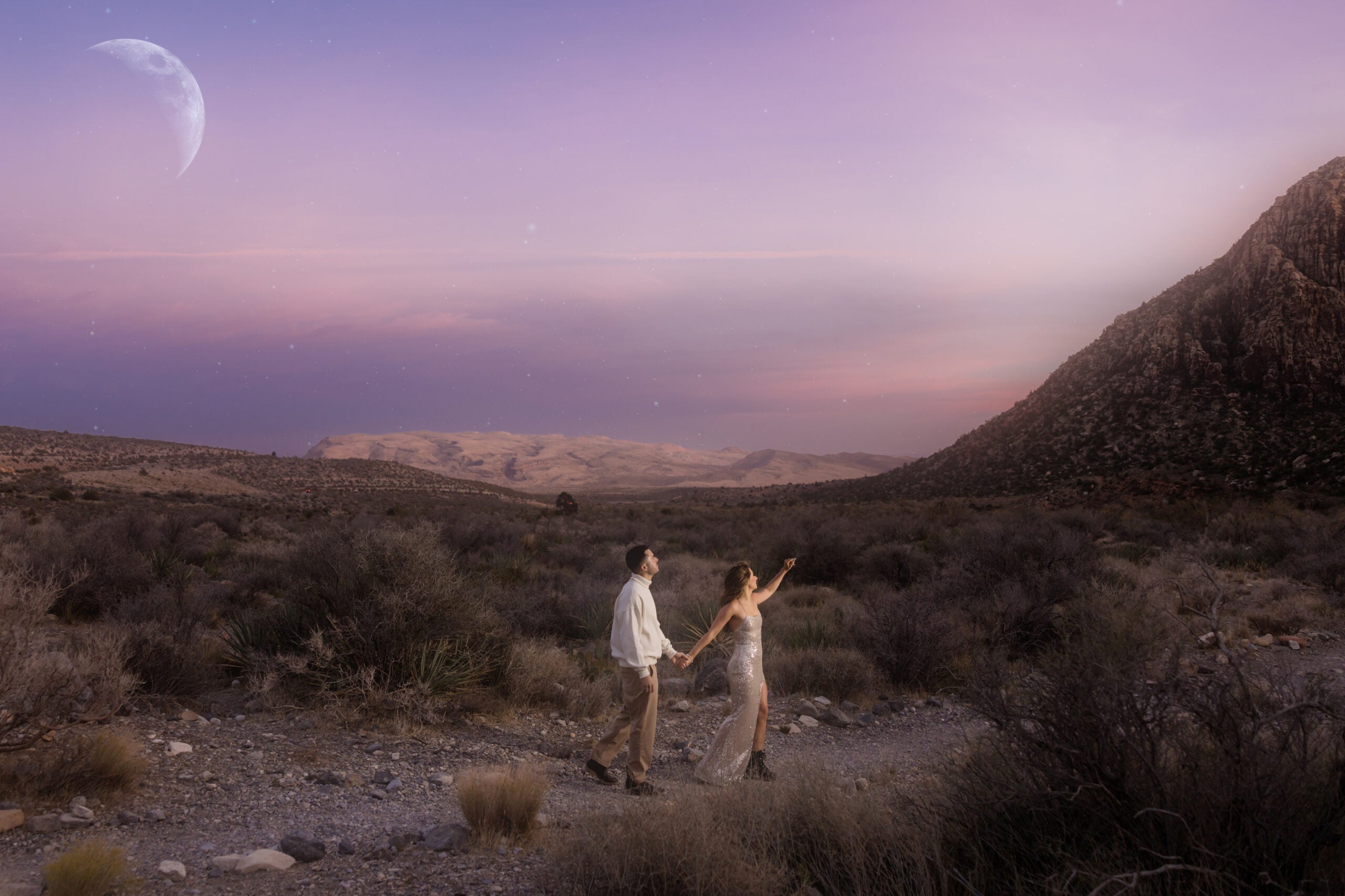 A bride and groom in the desert.