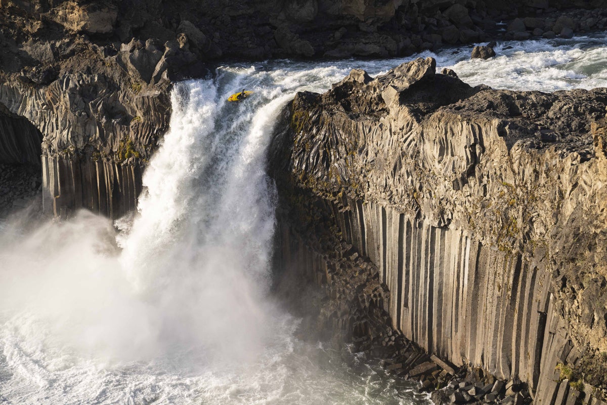 kayak goes over waterfall