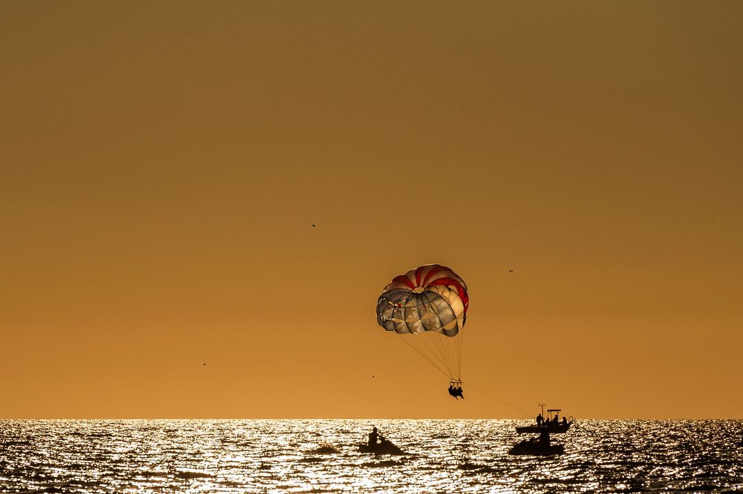 parasailing at sunset