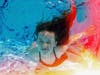 underwater photo of girl in a pool