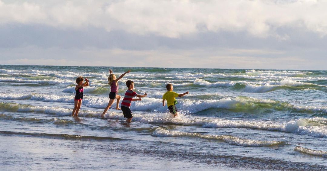 children playing in the ocean