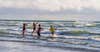 children playing in the ocean