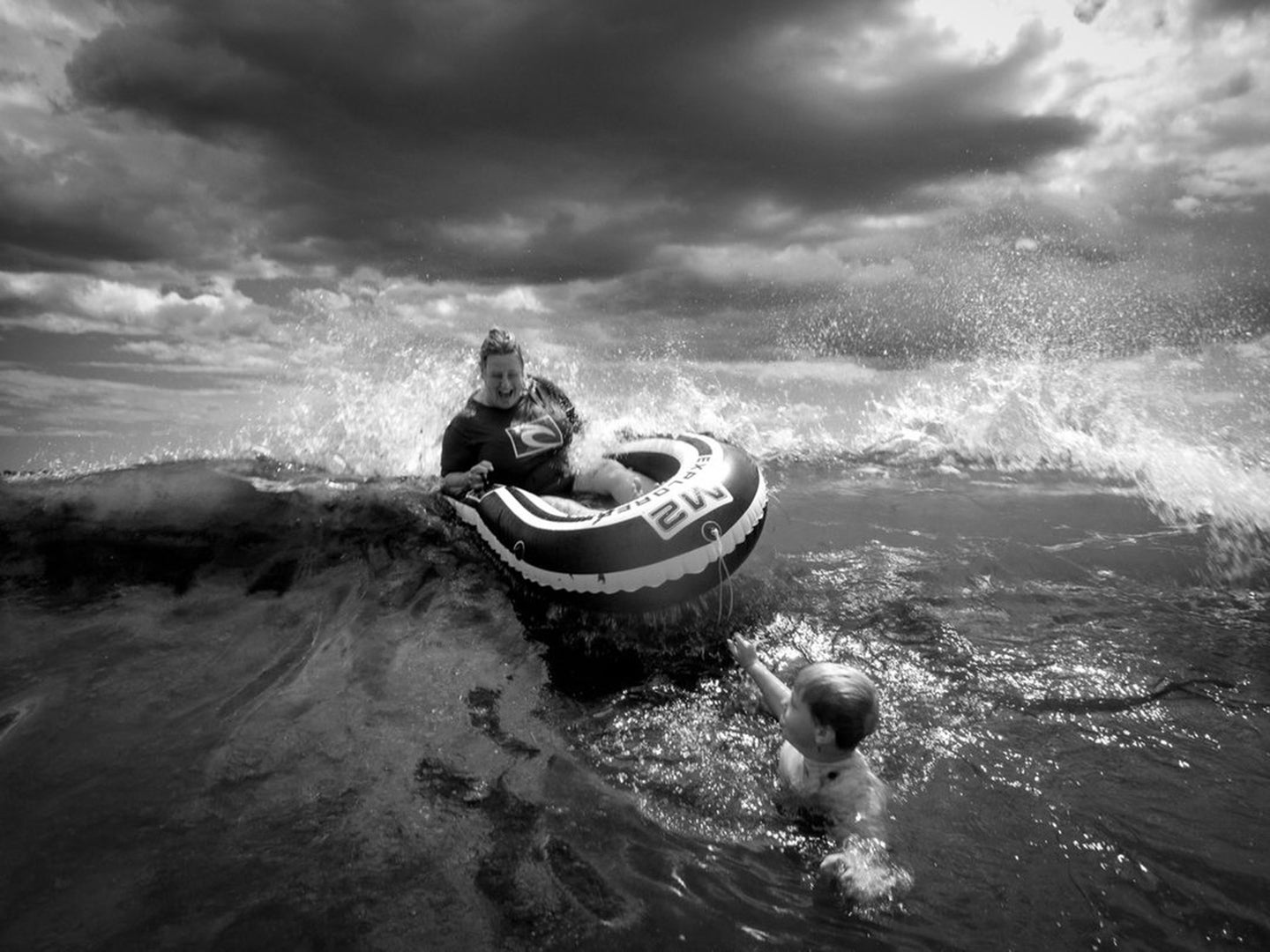 woman rafting riding a wave