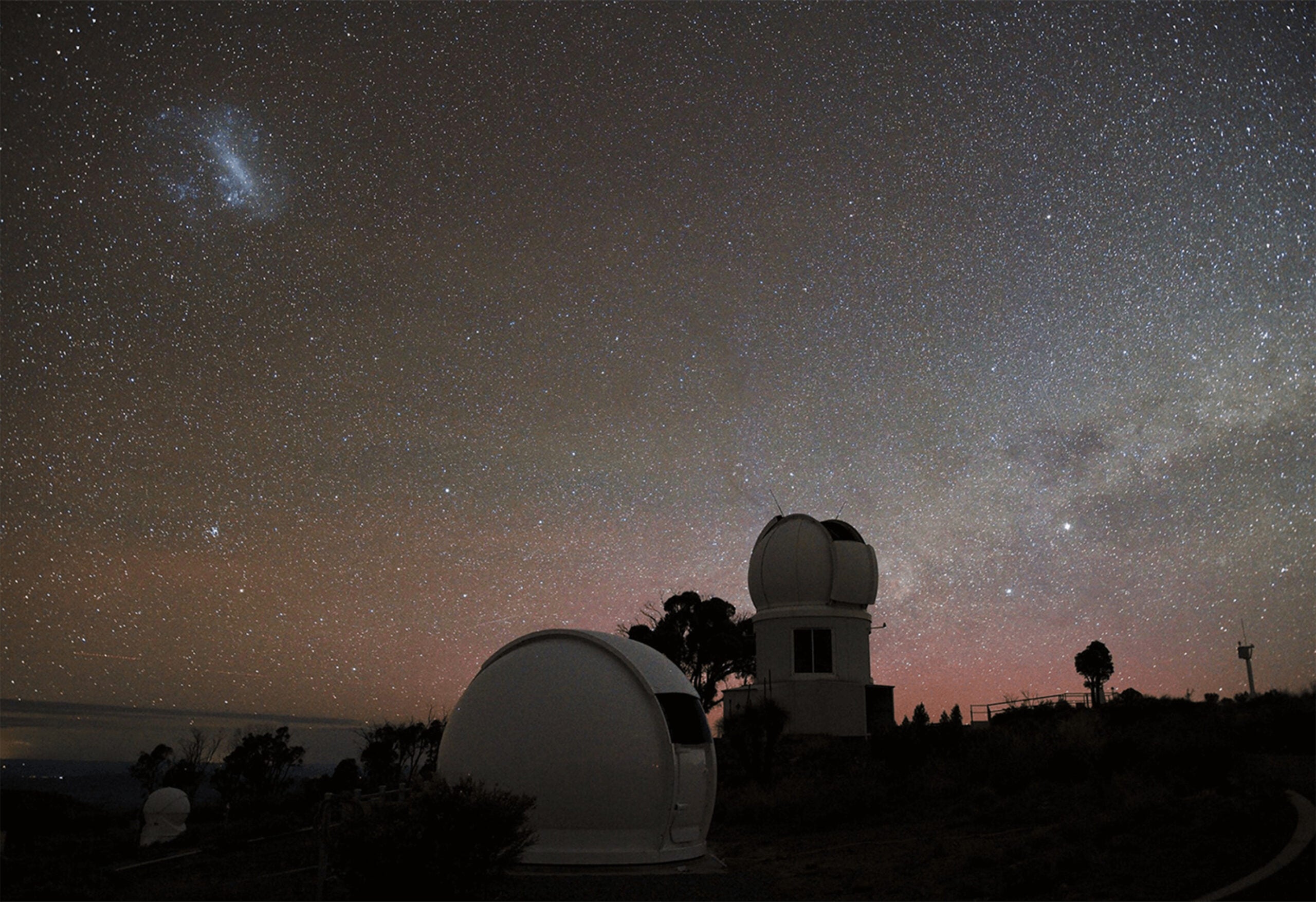 The Huntsman Telescope in its dome, located at Siding Spring Observatory, Coonabarabran with the SkyMapper Telescope behind it.