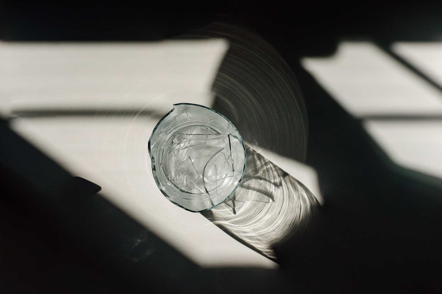 light streams through a broken water glass